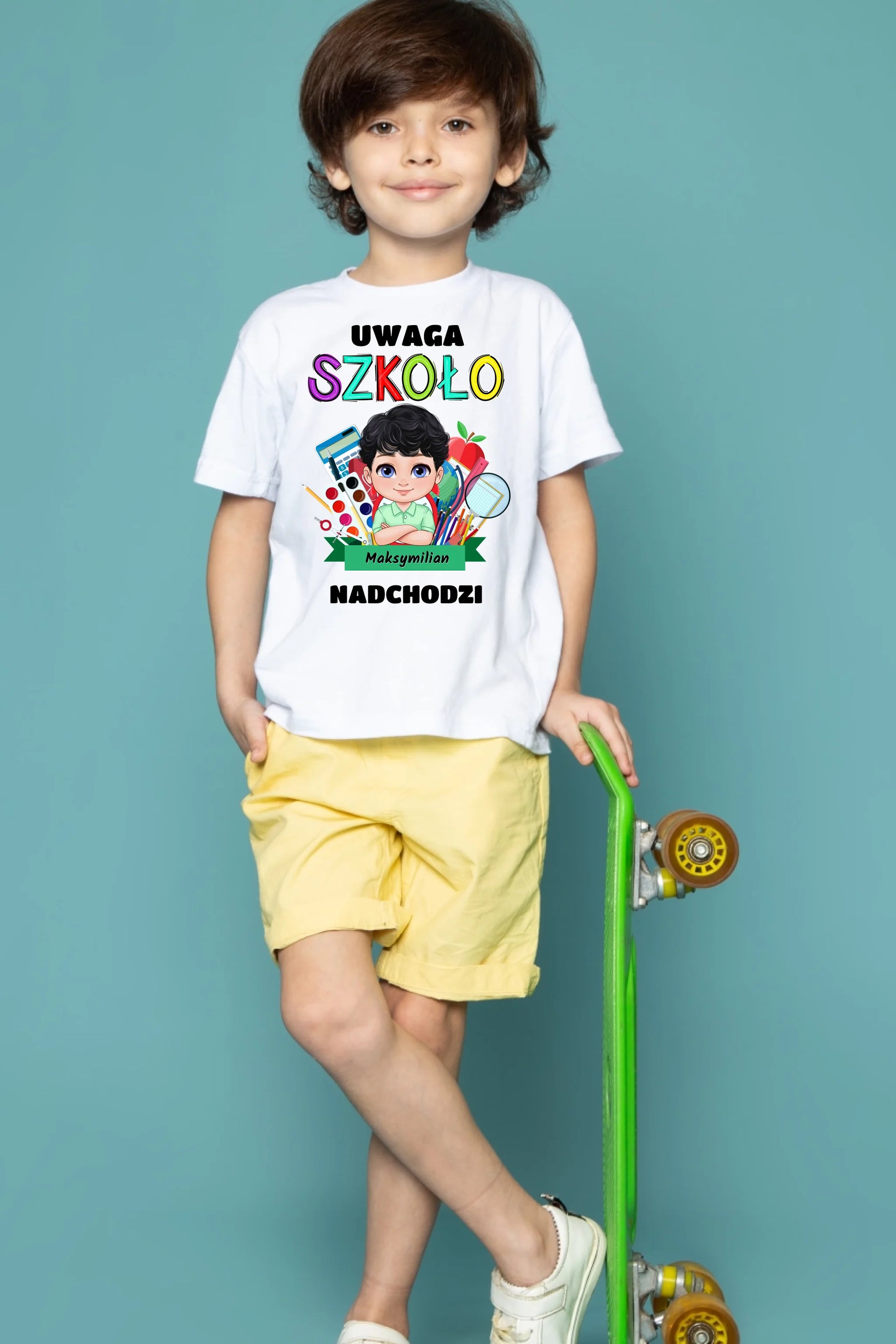 front-view-cute-child-boy-white-t-shirt-yellow-jeans-holding-green-skateboard-blue-floor
